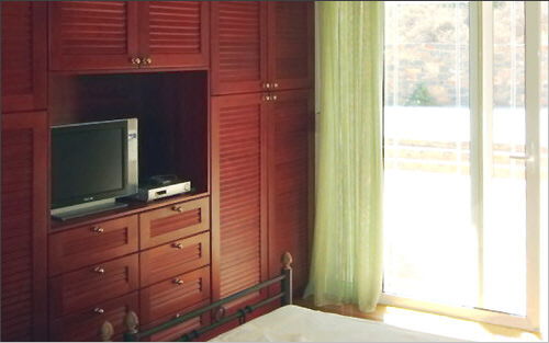Fitted wardrobe and TV set